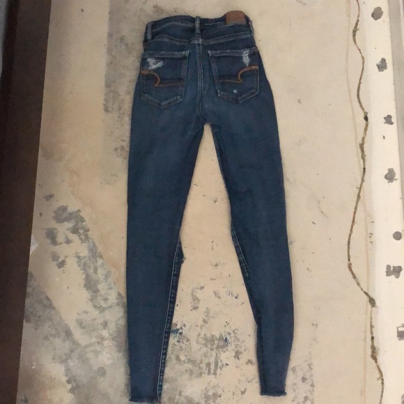 Size 0, Dark Blue Ripped American Eagle Jeans - Picture 2 of 3